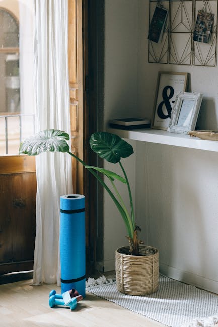Person relaxing on a yoga mat in a bright, modern living room.